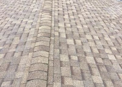 A shingled roof installation on a house.