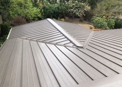 The residential roofing of a home with a metal roof.